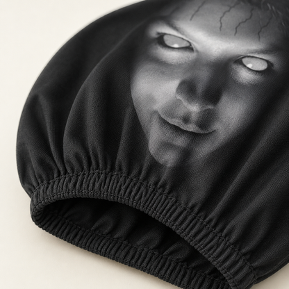 Close-up of the black polyester fabric and gathered elastic opening on a ScareSeat cover