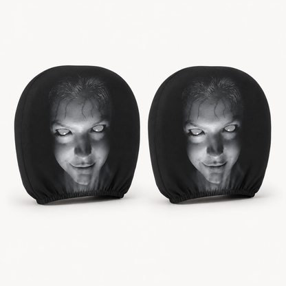 Two Pione ScareSeat black horror face car headrest covers on a warm white background